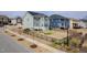 Spacious backyard featuring a deck, black fence, and a lush lawn for outdoor enjoyment at 601 Copper Beech Ln, Wake Forest, NC 27587