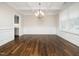 Dining room displaying a chandelier, wood floors, and wainscoting details at 601 Copper Beech Ln, Wake Forest, NC 27587