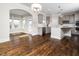 Modern kitchen with sleek gray cabinets and stainless steel appliances, open to living area at 601 Copper Beech Ln, Wake Forest, NC 27587