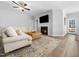 Cozy living room featuring a fireplace, comfortable seating, and natural light at 61 Andrews Landing Dr, Wendell, NC 27591