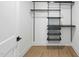 A modern closet with metal shelving offers an efficient storage solution at 615 W Peace St # 301, Raleigh, NC 27605