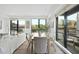 Bright dining room featuring a wooden table, chairs, and large windows overlooking the neighborhood at 615 W Peace St # 301, Raleigh, NC 27605