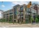 Modern brick apartment building featuring stylish balconies and urban design at 615 W Peace St # 301, Raleigh, NC 27605