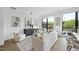 Bright living room featuring large windows, modern decor, and hardwood floors for a stylish, comfortable space at 615 W Peace St # 301, Raleigh, NC 27605