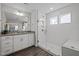 Luxurious bathroom with a frameless glass shower, double sinks, and granite countertops at 63 Capewood Ct, Garner, NC 27529