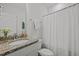 Neutral bathroom featuring a granite vanity, framed mirror and shower with curtain at 63 Capewood Ct, Garner, NC 27529