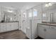 Spa-like bathroom features double vanities, a glass-enclosed shower, and modern finishes at 63 Capewood Ct, Garner, NC 27529