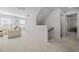 Bright hallway leading to living area features carpet floors and natural light at 63 Capewood Ct, Garner, NC 27529