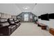 Home theater room featuring comfy seating, TV, and decorative baseball theme at 63 Capewood Ct, Garner, NC 27529