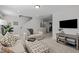 Comfortable living room with cozy seating, neutral tones, and access to upper level at 63 Capewood Ct, Garner, NC 27529
