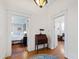 Hallway with hardwood floors leading to bedroom and living room at 632 E Franklin St, Raleigh, NC 27604