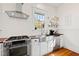 The kitchen features stainless steel appliances, subway tile backsplash, and butcher block countertops at 632 E Franklin St, Raleigh, NC 27604
