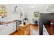 Bright kitchen with white cabinets, wood countertops, and stainless steel appliances at 632 E Franklin St, Raleigh, NC 27604