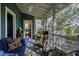 Cozy screened porch featuring comfortable seating, views to interior, and natural light; perfect for relaxation and enjoying the outdoors at 632 E Franklin St, Raleigh, NC 27604