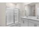 Modern bathroom featuring double sink vanity, a glass enclosed shower and luxury finishes at 71 Hawksmoore Ln, Lillington, NC 27546