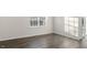 Sun-filled bedroom with a large window and hardwood floors at 71 Hawksmoore Ln, Lillington, NC 27546