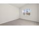 Bright bedroom featuring neutral carpet, light walls and a window with natural light at 71 Hawksmoore Ln, Lillington, NC 27546