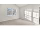 Bright carpeted bedroom with neutral walls and a window, creating a comfortable space at 71 Hawksmoore Ln, Lillington, NC 27546