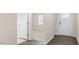 Bright entryway with durable vinyl flooring and a view into the carpeted living area at 71 Hawksmoore Ln, Lillington, NC 27546