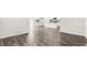 Open-concept living room featuring hardwood floors and bright, neutral paint at 71 Hawksmoore Ln, Lillington, NC 27546