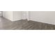Spacious living room with hardwood floors and white walls, creating a bright and airy feel at 71 Hawksmoore Ln, Lillington, NC 27546
