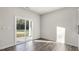 Bright living room with sliding glass doors leading to a patio and hardwood flooring at 71 Hawksmoore Ln, Lillington, NC 27546