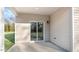 Outdoor patio with siding, a sliding glass door to the yard, and exterior lighting at 71 Hawksmoore Ln, Lillington, NC 27546