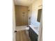 Modern bathroom features stylish vanity, walk in shower and tiled floor at 82 Cool Creek Dr, Willow Springs, NC 27592