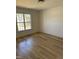 Bright bedroom with wood flooring and window offering ample natural light and neighborhood views at 82 Cool Creek Dr, Willow Springs, NC 27592