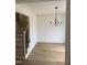 Open entryway with staircase and modern light fixture at 82 Cool Creek Dr, Willow Springs, NC 27592