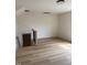 Open hallway featuring wood flooring, staircase, and railing to second story at 82 Cool Creek Dr, Willow Springs, NC 27592