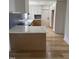 New kitchen with bright white quartz countertops, island and backsplash at 82 Cool Creek Dr, Willow Springs, NC 27592