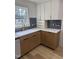 Modern kitchen features shaker cabinets, a white countertop, and stylish backsplash at 82 Cool Creek Dr, Willow Springs, NC 27592