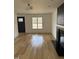 Cozy living room with fireplace, wood floors, and a bright window at 82 Cool Creek Dr, Willow Springs, NC 27592