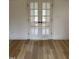 Interior room with double french doors, light-colored wood floors, and ample electrical outlets at 82 Cool Creek Dr, Willow Springs, NC 27592