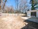 Large fenced backyard offering ample space and a small concrete patio area at 823 Elmira Ave, Durham, NC 27707