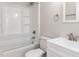 Bathroom features a shower over tub, white vanity and updated fixtures at 823 Elmira Ave, Durham, NC 27707
