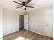 Bedroom featuring hardwood floors, neutral paint and standard closet at 823 Elmira Ave, Durham, NC 27707