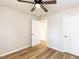 Bedroom featuring hardwood floors, neutral paint and standard closet at 823 Elmira Ave, Durham, NC 27707