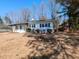 Charming home featuring manicured landscaping, a well-maintained lawn, and a classic design at 823 Elmira Ave, Durham, NC 27707