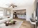 Open-concept living room and kitchen with modern furnishings and lots of natural light at 823 Elmira Ave, Durham, NC 27707