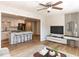 Open-concept living room with adjacent kitchen, featuring a modern ceiling fan and fixtures at 823 Elmira Ave, Durham, NC 27707
