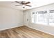 Minimalist room with large windows offering natural light and hardwood flooring at 823 Elmira Ave, Durham, NC 27707