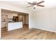 Living room featuring the kitchen with stainless steel appliances and granite countertops at 823 Elmira Ave, Durham, NC 27707