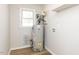 Utility room featuring a water heater and fresh paint at 823 Elmira Ave, Durham, NC 27707