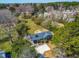 Aerial view of the home with mature trees and landscaping on a sprawling lot in a residential neighborhood at 8412 Pierce Olive Rd, Apex, NC 27539