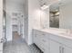 Bathroom with double sinks, walk-in closet, and shower at 9231 Bear Run Ln, Middlesex, NC 27557