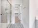 Bathroom with glass shower and view into walk in closet at 9231 Bear Run Ln, Middlesex, NC 27557