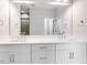 Bathroom with a double vanity and large mirror at 9231 Bear Run Ln, Middlesex, NC 27557