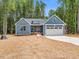 Beautiful single-story home featuring a two-car garage and a well-manicured front lawn at 9231 Bear Run Ln, Middlesex, NC 27557